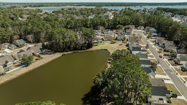 bird's eye view featuring a water view and a residential view