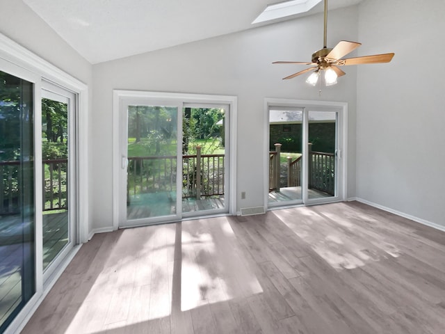 109 Evance Ct, Summerville, SC 29485 - unfurnished room with vaulted ceiling, a skylight, wood finished floors, and a ceiling fan