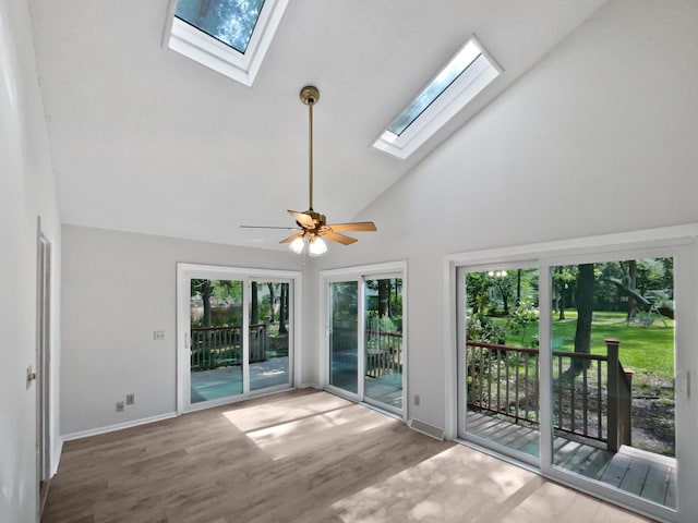 109 Evance Ct, Summerville, SC 29485 - empty room featuring a skylight, high vaulted ceiling, wood finished floors, and a ceiling fan
