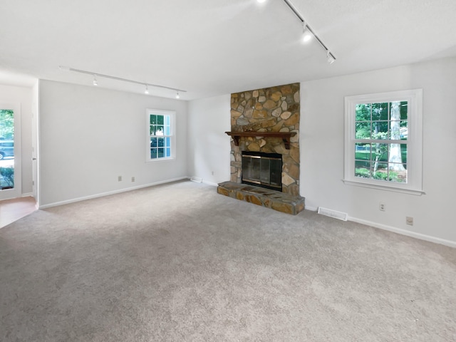 109 Evance Ct, Summerville, SC 29485 - unfurnished living room featuring track lighting, carpet flooring, and healthy amount of natural light