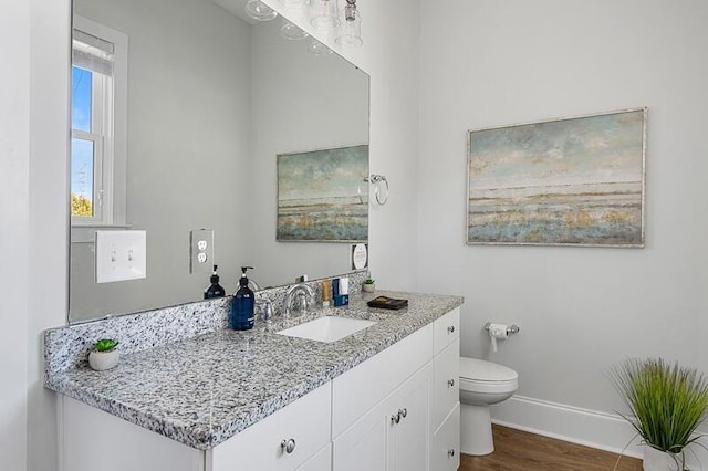 162 Spring St, Charleston, SC 29403 - bathroom featuring wood finished floors, baseboards, toilet, and vanity