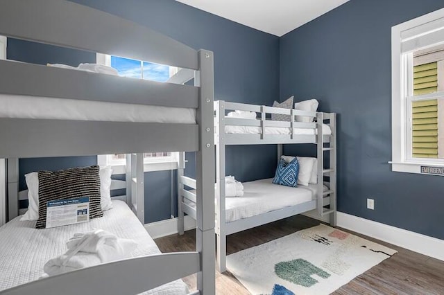 162 Spring St, Charleston, SC 29403 - bedroom with wood finished floors, multiple windows, and baseboards