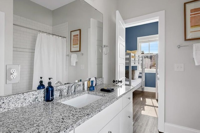 162 Spring St, Charleston, SC 29403 - bathroom featuring baseboards, curtained shower, vanity, and wood finished floors