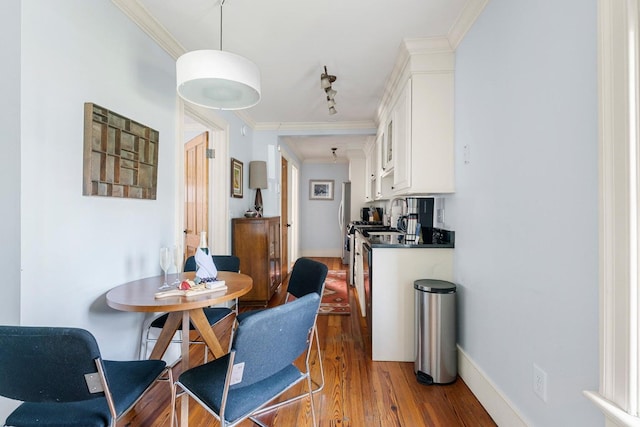 162 Spring St, Charleston, SC 29403 - dining area featuring wood finished floors, crown molding, and baseboards