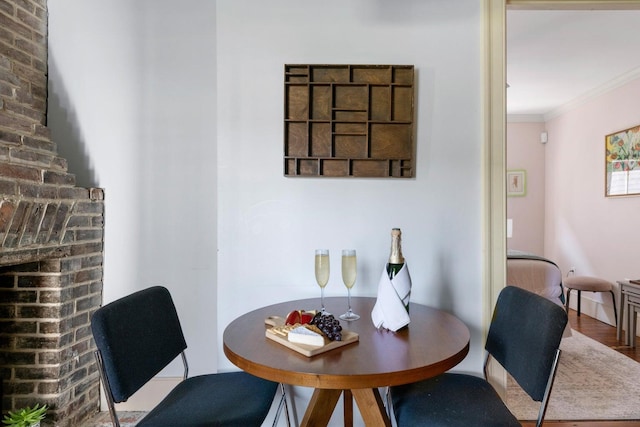 162 Spring St, Charleston, SC 29403 - dining space with crown molding and wood finished floors