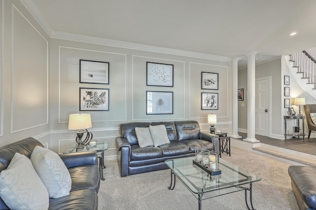 carpeted living room with crown molding and decorative columns