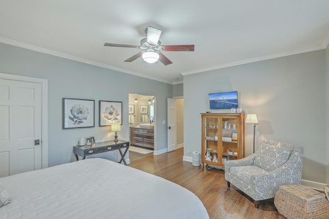 bedroom featuring hardwood / wood-style flooring, ornamental molding, sink, and ceiling fan