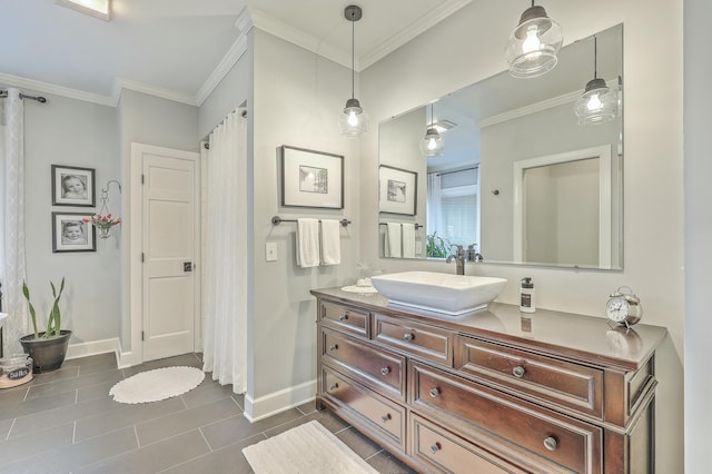 bathroom with tile patterned floors, ornamental molding, and vanity