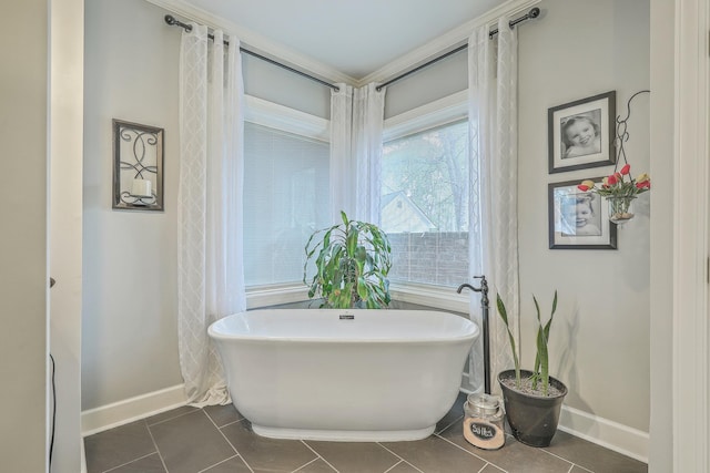 bathroom featuring a tub to relax in and tile patterned floors