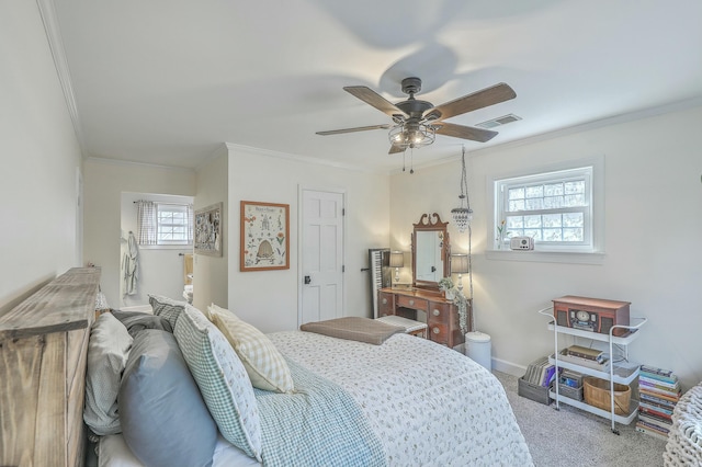 carpeted bedroom featuring multiple windows, ornamental molding, and ceiling fan