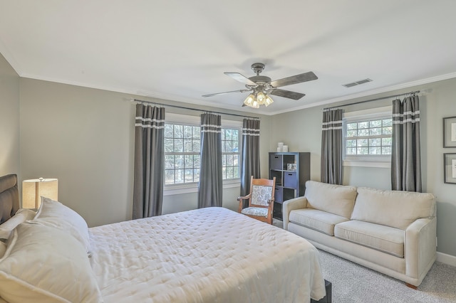 bedroom featuring crown molding, ceiling fan, and carpet flooring