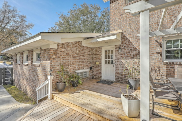 entrance to property with a wooden deck