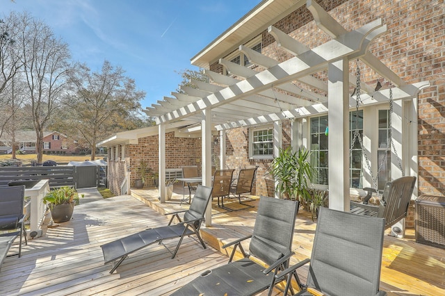 wooden deck featuring a pergola