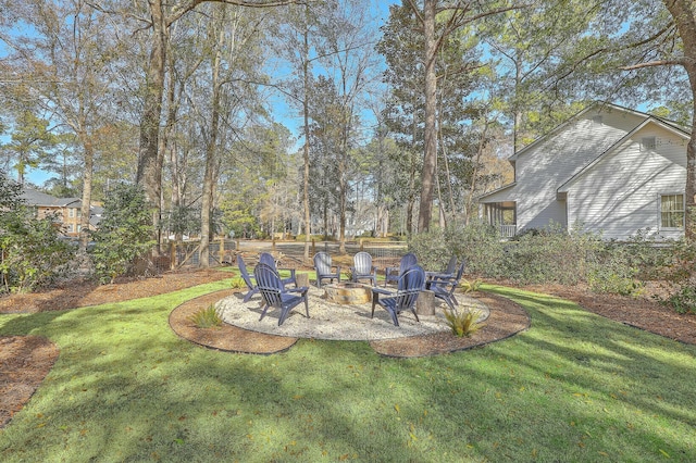 view of yard featuring a fire pit and a patio area