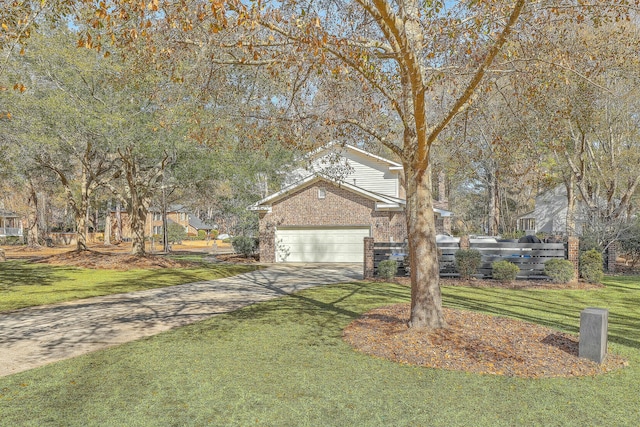 view of front of home with a garage and a front lawn