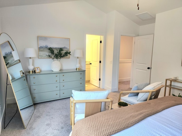 bedroom with vaulted ceiling, visible vents, ensuite bathroom, and light carpet