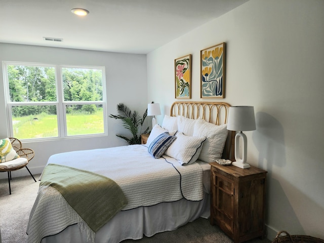 bedroom featuring visible vents and carpet