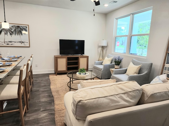 living room featuring visible vents, a ceiling fan, recessed lighting, baseboards, and dark wood-style flooring