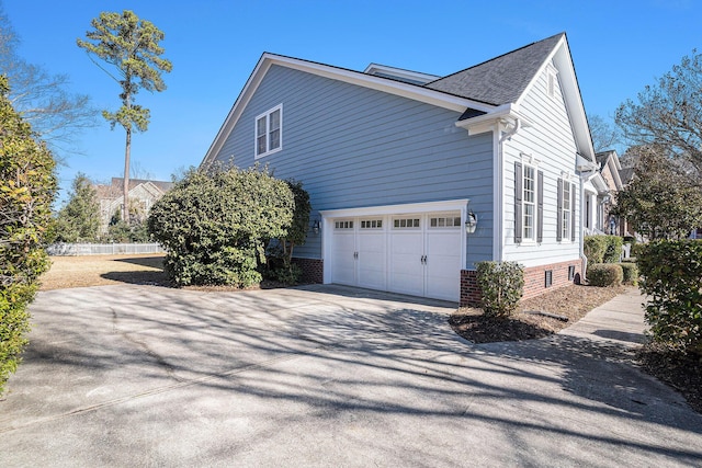 view of property exterior featuring a garage