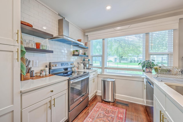 1188 Camden St, North Charleston, SC 29405 - kitchen with visible vents, open shelves, wall chimney range hood, wood finished floors, and stainless steel appliances
