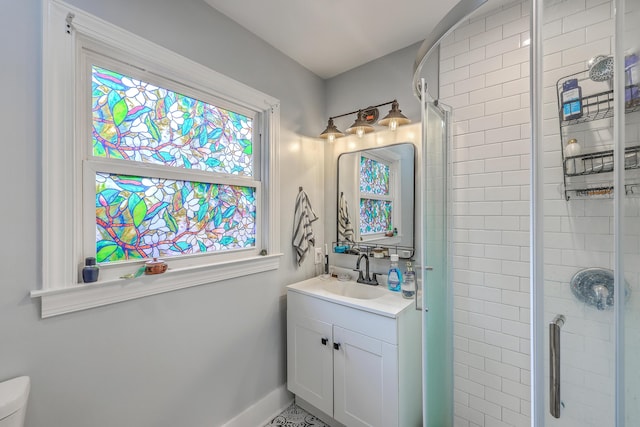 1188 Camden St, North Charleston, SC 29405 - bathroom featuring toilet, a stall shower, baseboards, and vanity