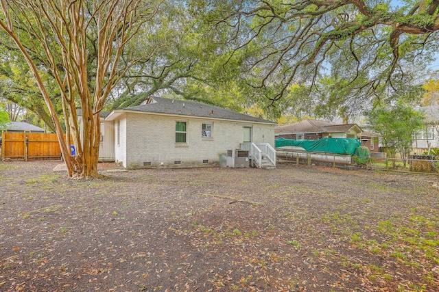 1188 Camden St, North Charleston, SC 29405 - back of property with brick siding, crawl space, cooling unit, and fence private yard