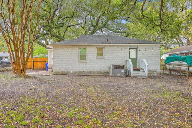 1188 Camden St, North Charleston, SC 29405 - rear view of property with brick siding, crawl space, central air condition unit, and fence