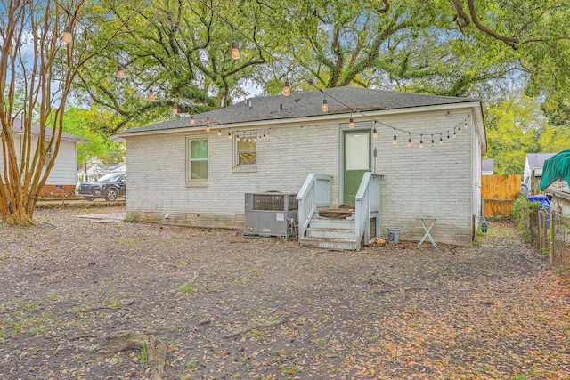 1188 Camden St, North Charleston, SC 29405 - rear view of property with central AC unit, fence, and brick siding