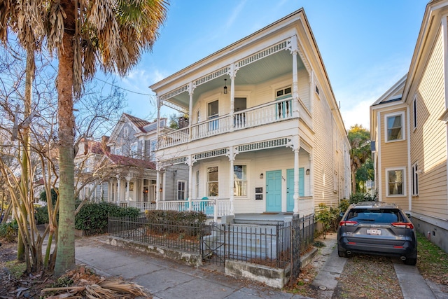 view of front of home featuring a porch and a balcony