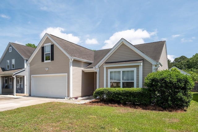 view of front of property featuring concrete driveway, a front yard, an attached garage, and roof with shingles