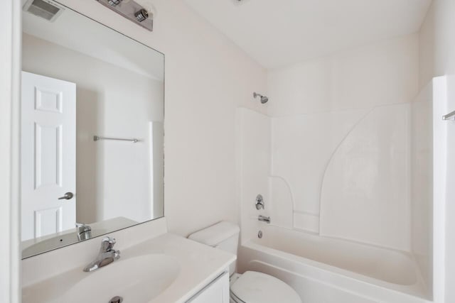 full bath featuring toilet, vanity, and shower / bathtub combination