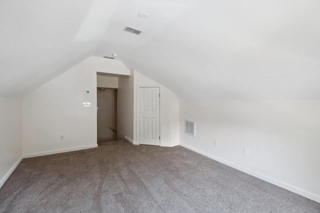 bonus room featuring carpet floors, vaulted ceiling, and baseboards