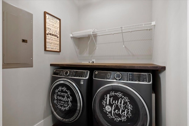 washroom with electric panel and independent washer and dryer