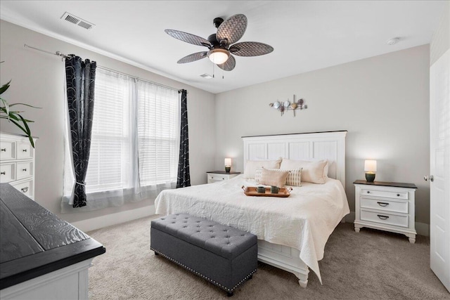 bedroom with light colored carpet and ceiling fan