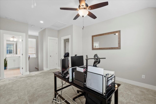 home office with light carpet and ceiling fan