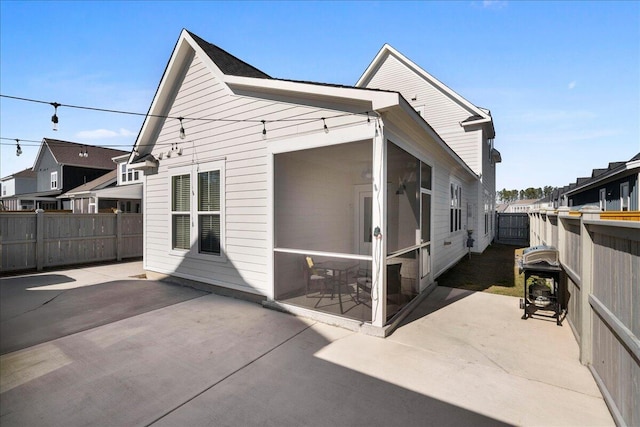 rear view of property featuring a patio