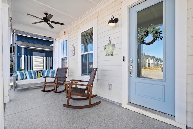 property entrance featuring ceiling fan and covered porch