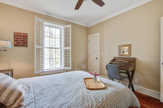 bedroom featuring ornamental molding, multiple windows, wood finished floors, and baseboards