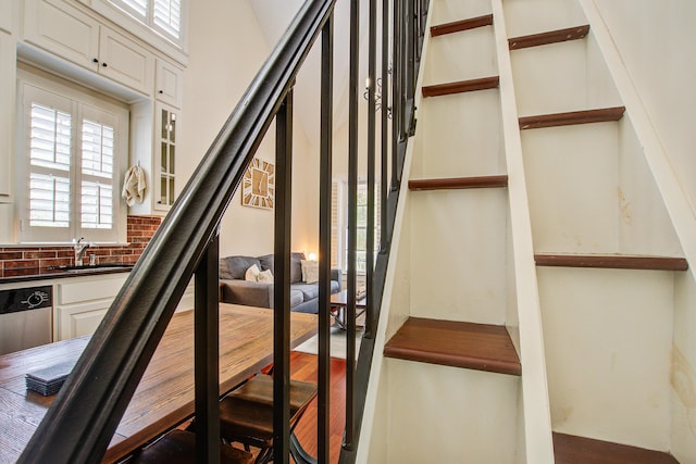 staircase featuring wood finished floors