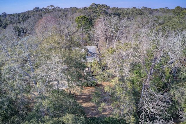 drone / aerial view featuring a forest view