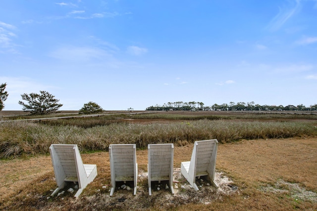 view of yard with a rural view and mail area