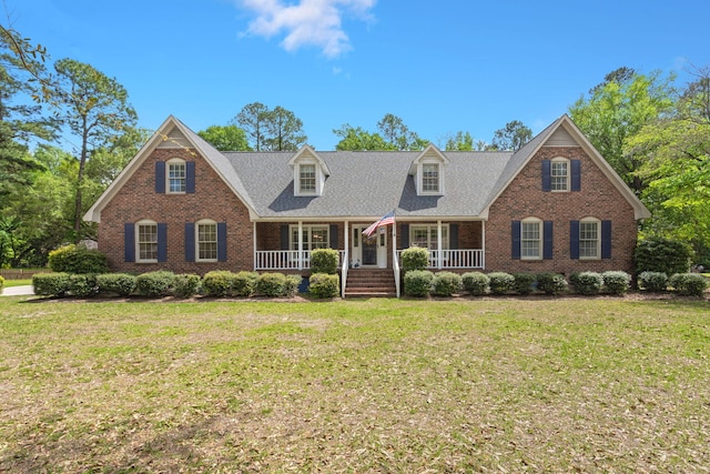 view of front of home featuring a front lawn and a porch