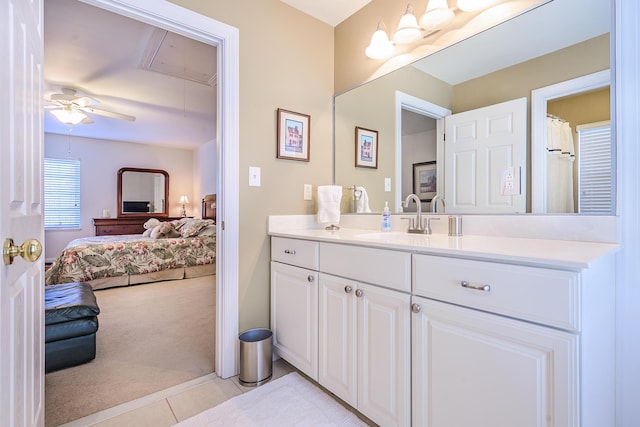 bathroom with tile patterned flooring, connected bathroom, vanity, and ceiling fan