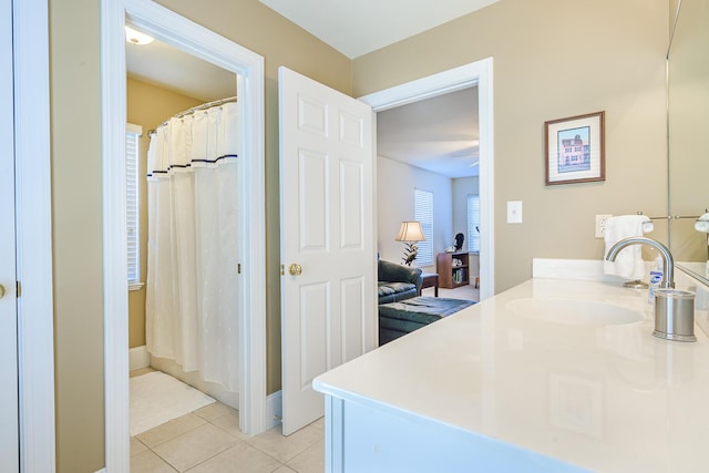 full bathroom featuring vanity, a shower with shower curtain, and tile patterned floors