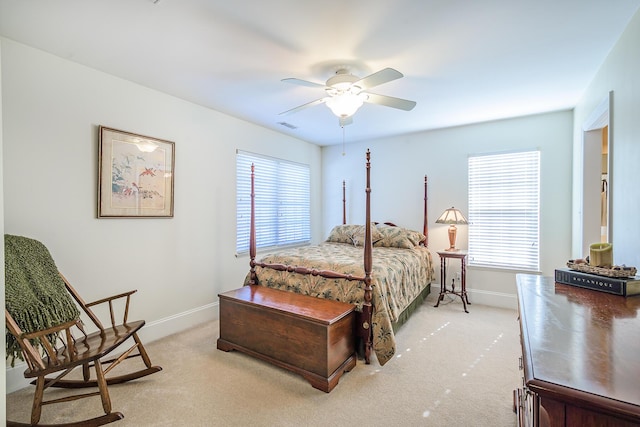 bedroom with visible vents, baseboards, ceiling fan, and light colored carpet