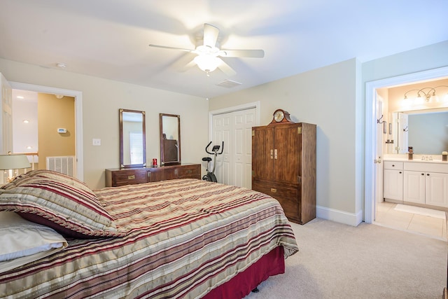 bedroom with light carpet, a closet, visible vents, and a ceiling fan