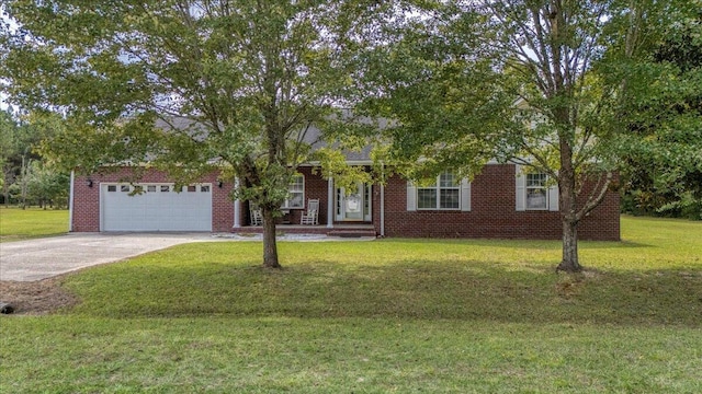 view of front of property with a garage and a front lawn