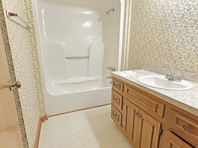 bathroom featuring shower / bath combination and vanity