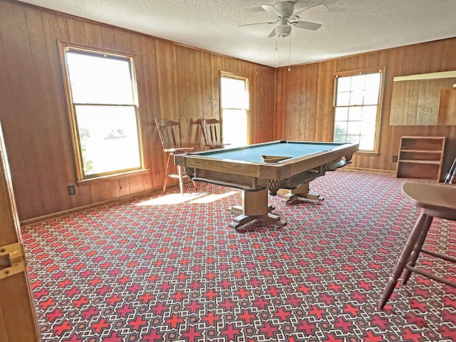 rec room with carpet floors, billiards, and wooden walls