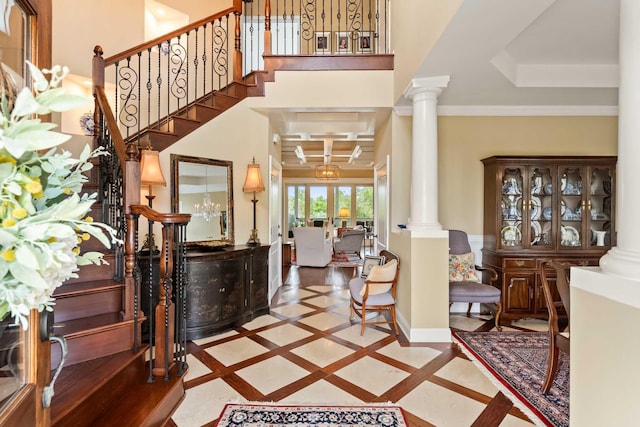 2636 Anchor Watch Dr, Wadmalaw Island, SC 29487 - foyer featuring baseboards, stairs, ornamental molding, and decorative columns